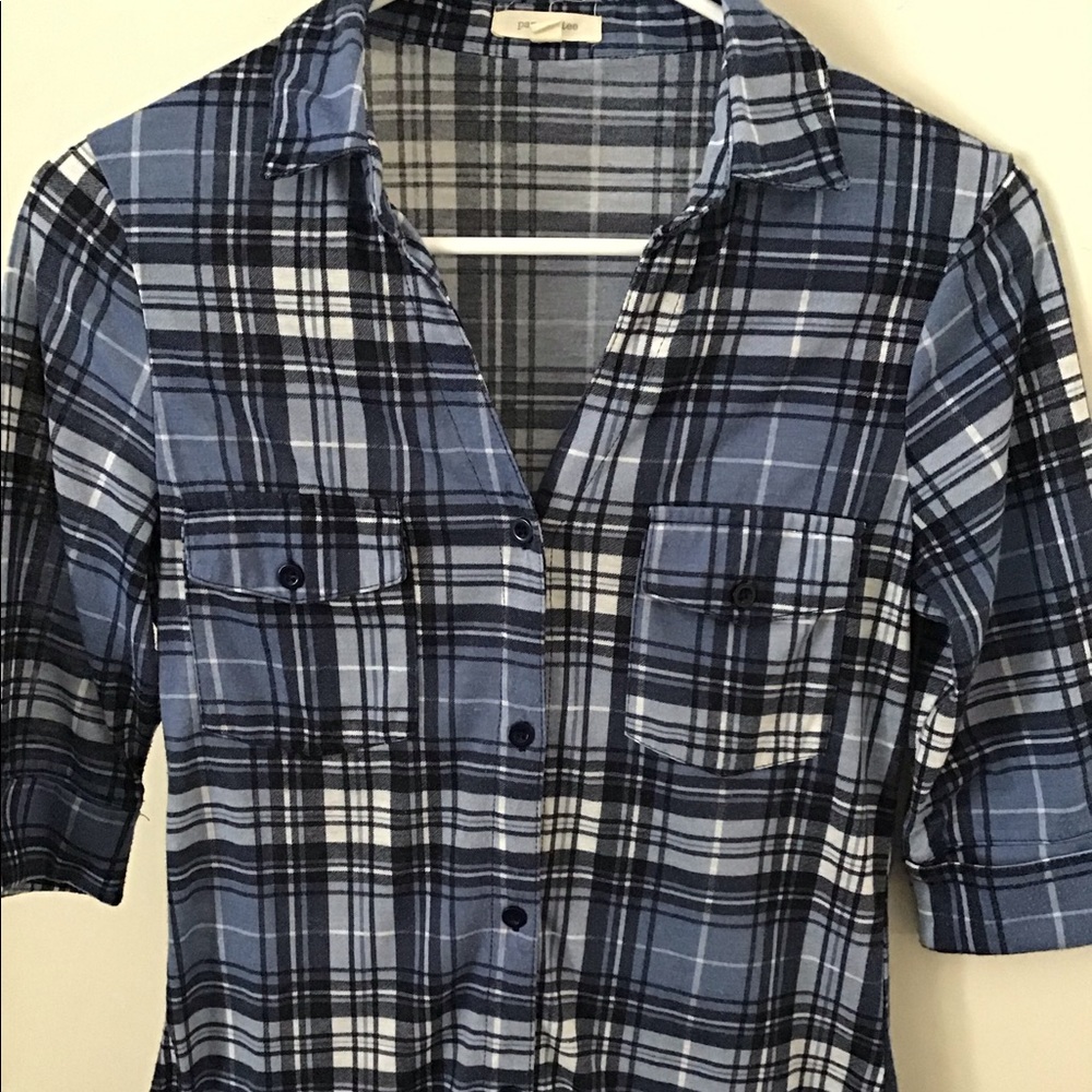 Women’s blue plaid button down top.
